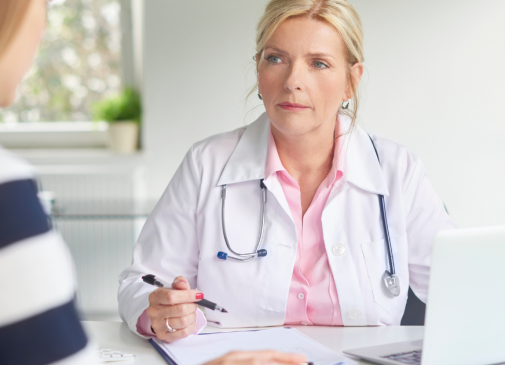 woman discussing pelvic floor muscle dysfunction with doctor